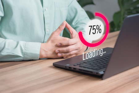 Adult man using a laptop computer for download software and waiting to loading digital business data...
