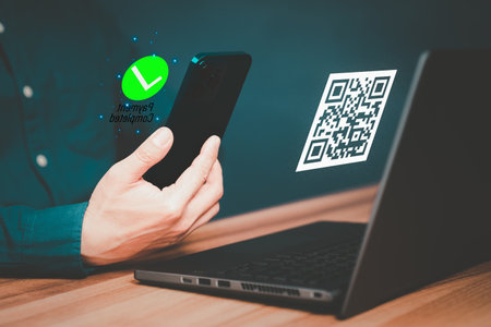 Concept of using smartphones to scan QR codes to make payment. Customer making payment through mobile phone and scan code for online shopping. Use of technology in the daily life of modern people.の写真素材