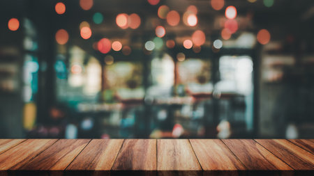 Empty top of wodd table with blur cafe or coffee shop background.の写真素材