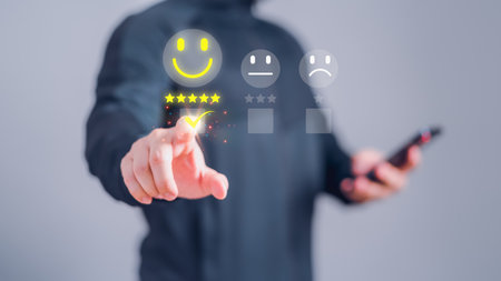 Man touching the virtual screen on the happy smiley face icon and five star to assessment satisfaction in service. Rating very impressed. Customer service, testimonial and satisfaction concept.の素材