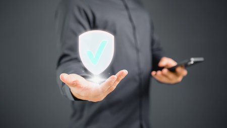 Man showing the shield protect icon. Protection personal data and network security computer concept. Cyber security and protection against danger. The best quality assurance product and service.の写真素材