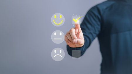 Assessment testimonial customer service and feedback concept, Business man are touching the virtual screen on the happy smile face icon to give satisfaction in service. Opinion rating very impressed.の写真素材