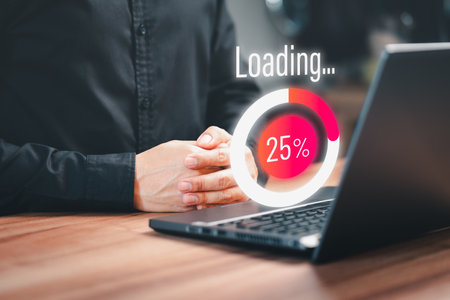 Employee man using a laptop computer for download software and waiting to loading digital business data form website, very slow internet form wifi. Concept of waiting for load of loading symbol.の写真素材