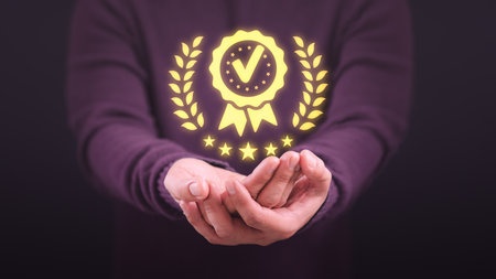 Man hand showing the best quality assurance with five stars. Assessment quality assurance of business services. Guarantee, warranty, standard, ISO certification, review, feedback, testimonial concept.の写真素材