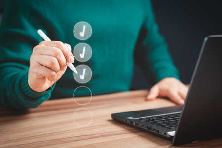 Businessman using pen tick correct sign mark for document approval and checklist planning concept. Take an assessment, evaluation, test, education, questionnaire, online survey online exam.の写真素材