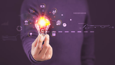 Hand holding a light bulb with global internet connection the Ai technology, Cloud computing, Big Data Storage, Internet network security, Finance, Online Shopping, Digital link tech and banking.の写真素材