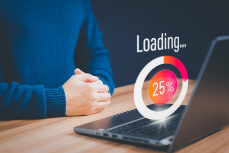 Concept of waiting for load of loading symbol. Young man using a laptop computer for download software and waiting to loading digital business data form website, very slow internet form wifi.の写真素材