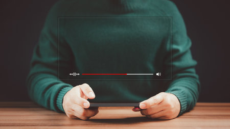 Man using a smartphone for watching video streaming online on virtual screen. Live sport, movie, music, searching video on internet, concept of content online on mobile phone.の写真素材