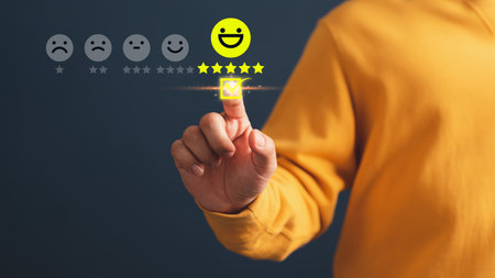 Client touching virtual screen on the happy smile face icon and five stars to give satisfaction in service. Opinion rating very impressed. Assessment testimonial customer service and feedback concept.の写真素材