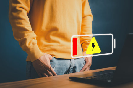 No power battery. Man is angry and frustrated when he learns that his the laptop computer's battery...