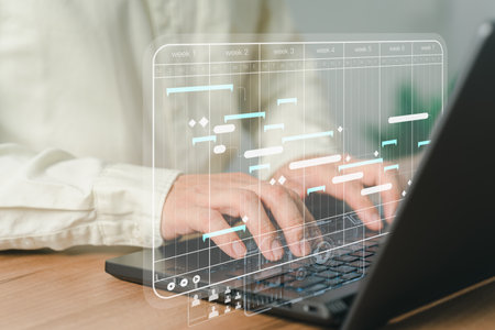 Employee working data analytics with computer in business management system to make report with KPI and metrics connected to database. Corporate strategy for finance, operations, sales, marketing.の写真素材
