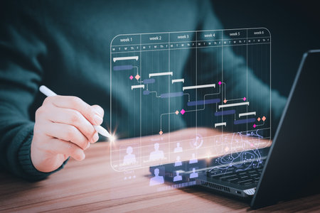 Man working with technology computer in business analytics and data management system to make report with KPI and metrics connected to database. Corporate strategy for operations, planning, marketingの写真素材