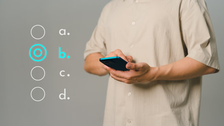 Young man using a phone tick correct sign mark for document approval and checklist planning concept. Take an assessment, evaluation, test, education, questionnaire, online survey online exam.の写真素材