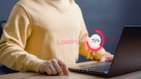 Adult man using a laptop computer for download software and waiting to loading digital technology data form website, very slow internet form wifi. Concept of waiting for load of loading symbol.の写真素材