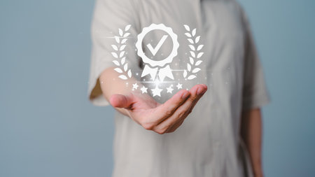 Male hand showing the best quality guarantee with five stars. Testimonial, Assurance, Standards, ISO Certification, Review, Feedback and Certification Concept. Assessment quality of business service.の写真素材