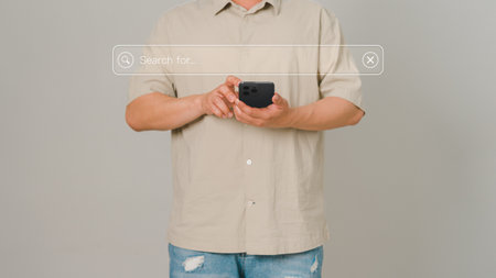 Guy using a smartphone to connect to wifi at home. Search engine optimization of the internet with the search bar. Best SEO technology networking, Searching browsing internet data information concept.の写真素材