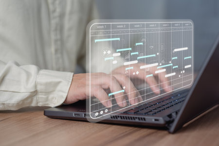 Business man working data analytics with computer in business management system to make report with KPI and metrics connected to database. Corporate strategy for finance, marketing, operations, sales.の写真素材