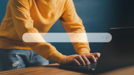 User working with a laptop computer on the table. Search engine optimization of the internet with the search bar. Best SEO technology networking, Searching browsing internet data information conceptの写真素材