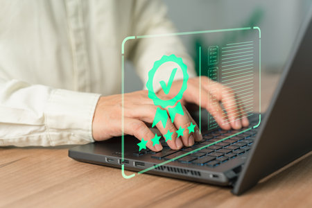 Customer using a laptop with virtual screen assessment sign of the top service quality assurance certificate for industrial and business. Guarantee, Standard, ISO certification concept.の写真素材