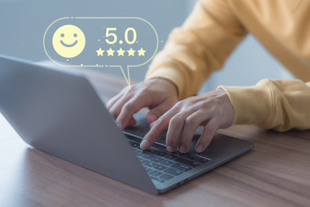 Male customer using a computer laptop in give rating to service experience assessment on application. Online customer review satisfaction feedback survey and testimonial.の写真素材