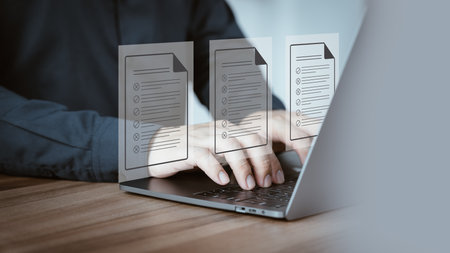 Adult man using laptop computer with virtual screen contact questionnaire with checkbox. Document Management Checking System, online documentation database and process manage files. Technology DMS.の写真素材