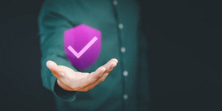 Certified guarantee approval or secure access system concept. User show on hand warranty identity proof icon for security protection system on virtual screen. Quality assurance of business service.の写真素材