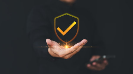 User hand show on warranty identity proof icon for security protection system on virtual screen. Quality assurance of business service. Certified guarantee approval or secure access system concept.の写真素材