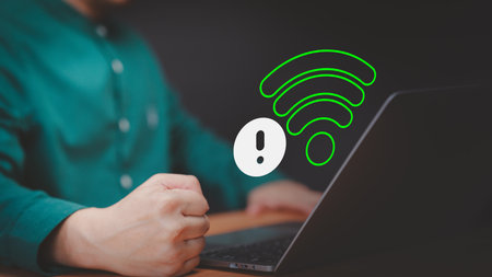 Technology concept of wifi connected but no internet. User using a laptop computer to connect to wifi but wifi not connected or password is incorrect and waiting to loading digital data form website.の写真素材