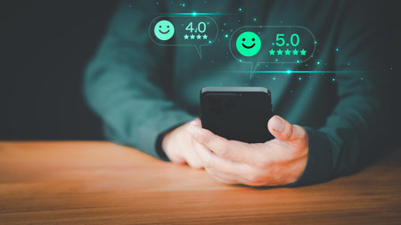 Male customer using a smartphone in give rating to service experience assessment on application to the shops. Online customer review satisfaction feedback survey and testimonial on mobile phone.の写真素材