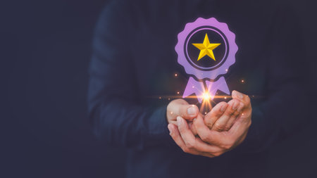 Assessment quality assurance of business services, guarantee, warranty, standard, certification, testimonial concept. Businessman hand show the best quality assurance with golden star warranty icon.の写真素材