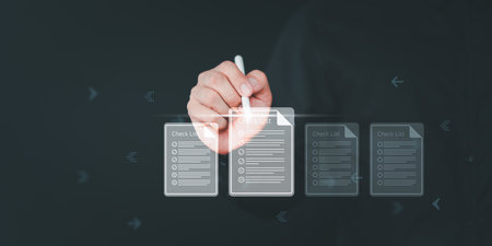 Business performance checklist. Businessman using pen doing online checklist survey, digital form online exam, take an assessment, questionnaire, documentation database and process manage files.の写真素材