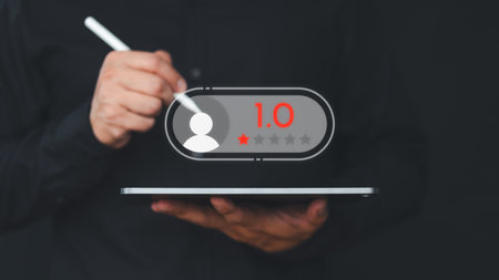 Client give rate 1 star with angry emotion face on virtual screen. Assessment testimonial review for dislike service and low quality. Business service concept of customer experience dissatisfaction.の写真素材