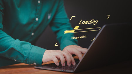 Concept of waiting for load of loading symbol. User man using a laptop computer for download and update software and waiting to loading digital file data form website, very slow internet form wifi.の写真素材