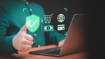 Customer use a computer laptop with sign of security protection system on virtual screen. Guarantee, Standard, Certified guarantee approval or secure access internet. Shopping on online application.の写真素材