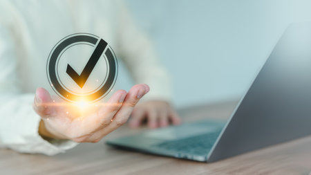 User man showing on hand identity proofing icon for security protection system on virtual screen. Certified guarantee approval or secure access system concept. Quality assurance of business service.の写真素材