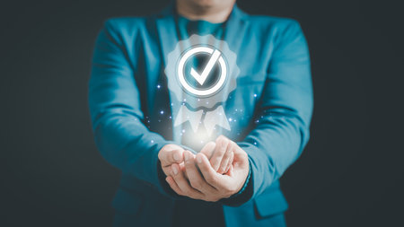 Businessman hand show the best quality assurance with warranty icon. Assessment quality assurance of business services, guarantee, warranty, standard, certification, testimonial concept.の写真素材