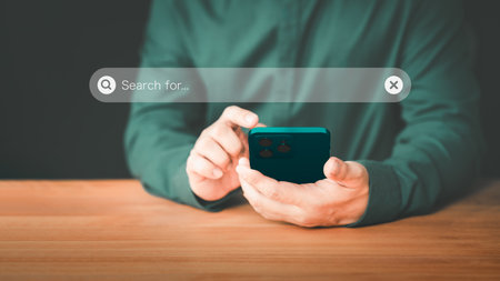 User using a smartphone clicking internet search bar accessing homepage. SEO technology networking engine optimization internet with search bar. Searching browsing internet data information concept.の写真素材