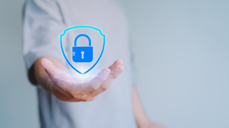 User hand show the shield security icon for security protection system on virtual screen. Secure access system concept. Quality assurance of business service, Certified guarantee approval.の写真素材
