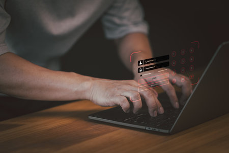 Man type username and password for the computer laptop. Cyber security concept to protect personal data. Secure encryption and access to the user's private information to access the internetの写真素材