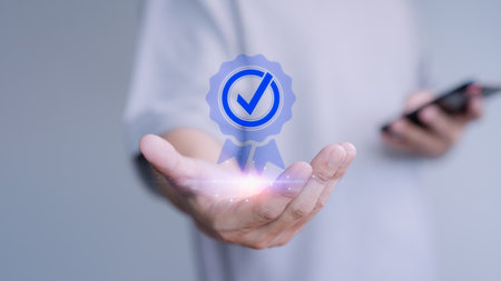 Customer hand show the best quality assurance with warranty iconの写真素材