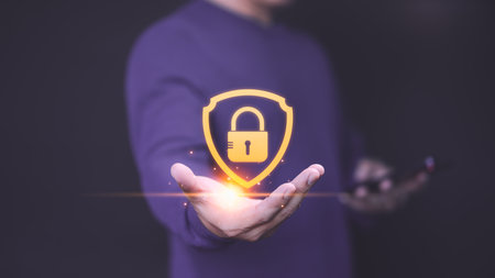 User hand show the shield security icon for security protection system on virtual screen. Secure access system concept. Quality assurance of business service, Certified guarantee approval.の写真素材