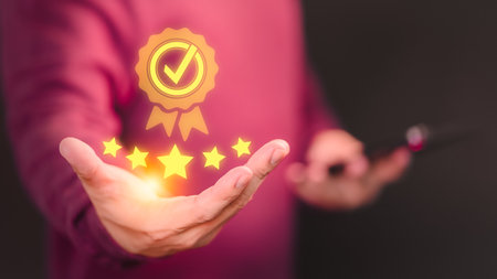 Hand showing the best quality guarantee with five stars. Testimonial, Assurance, Standards, ISO Certification, Review, Feedback and Certification Concept. Assessment quality of business service.の写真素材
