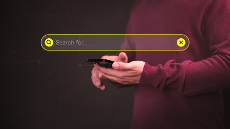 User using a smartphone clicking internet search bar. SEO technology networking engine optimization internet with search bar. Searching browsing internet data information concept.の写真素材