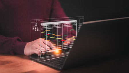 Employee working with computer in business analytic and data management system to make report with KPI and metric connect to database. Corporate strategy for operations, planning, marketing, HRの写真素材