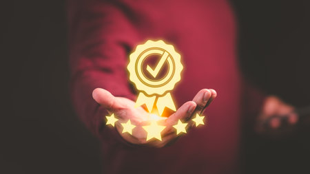 Assessment quality of business service. Male hand showing the best quality guarantee with five stars. Testimonial, Assurance, Standards, ISO Certification, Review, Feedback and Certification Concept.の写真素材