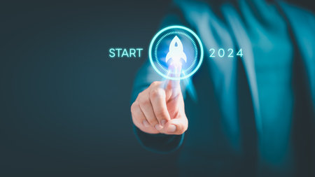 Businessman touching space rocket icon for start in 2024, Corporate Ambitions, Achieving Success through Innovation, plan and vision, progress and success, business challenge technology concept.の写真素材