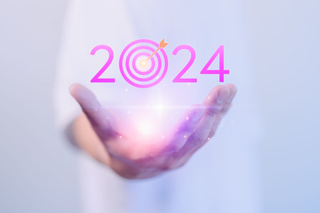 Male hand show the goal 2024 icon, target for working, success, savings money, good health, life...