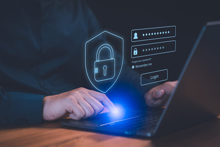 Cyber â€‹â€‹security and digital data protection technology concept. Man use a laptop...