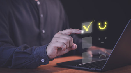 Customer select a happy face icon on a feedback scale with neutral and sad face options below. Concept symbolized customer satisfaction, online reviews, decision-making in user experience evaluation.の写真素材
