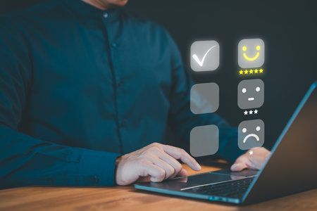 Customer take a satisfaction survey using an online application to evaluate their service experience. This assessment helps determine the quality of service and business reputation score.の写真素材